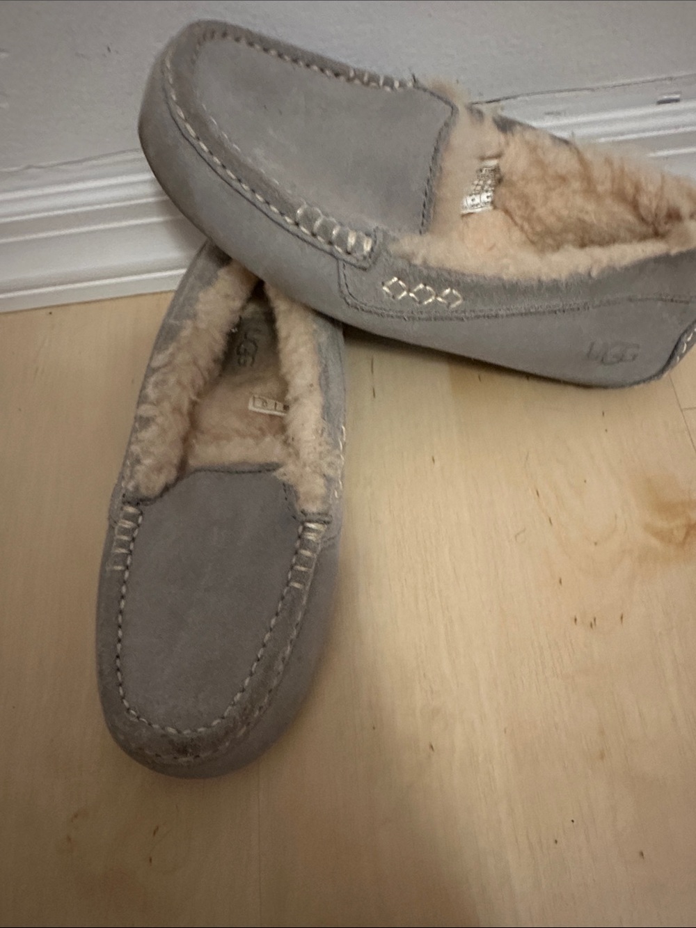 UGG womenโs Grey Suede Shearling-Lined Slip-On Moccasins